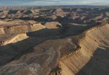 Utah approved blasting 100-foot canyon cliffs to widen a 5.3-mile road for oil trucks; after two earlier plans failed, a new federal lawsuit says 47 historic sites and 19th-century inscriptions are at risk